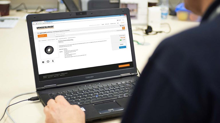 View of a man browsing a Vanderlande Spare Parts page