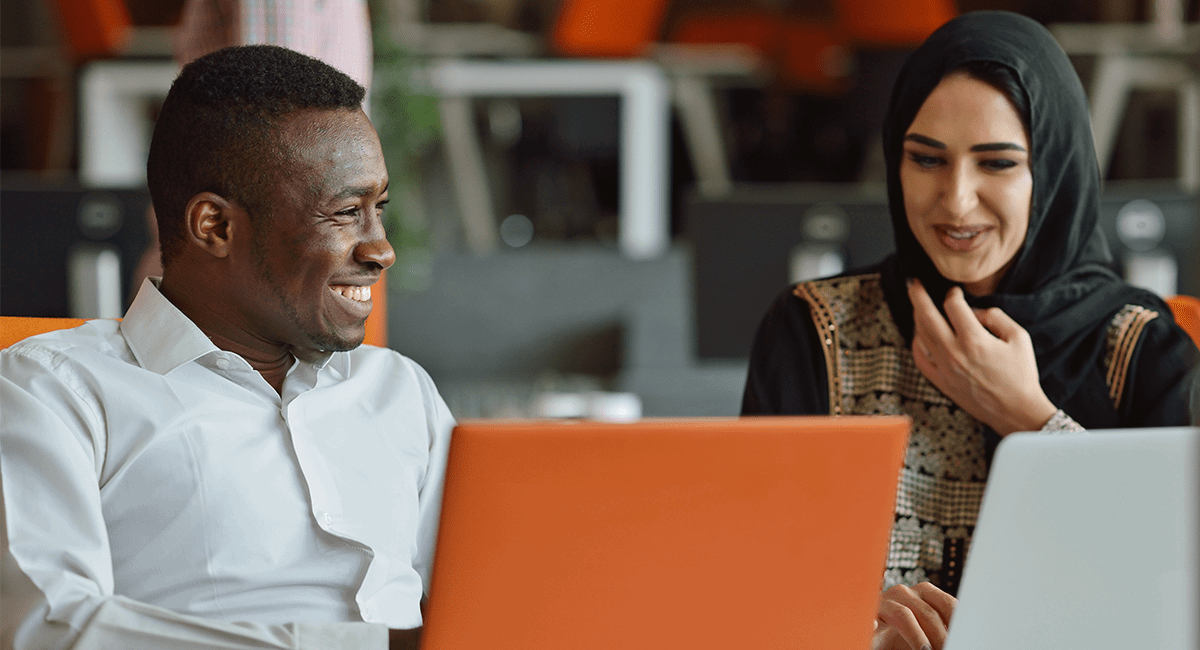 A man and a woman collaborating on a project