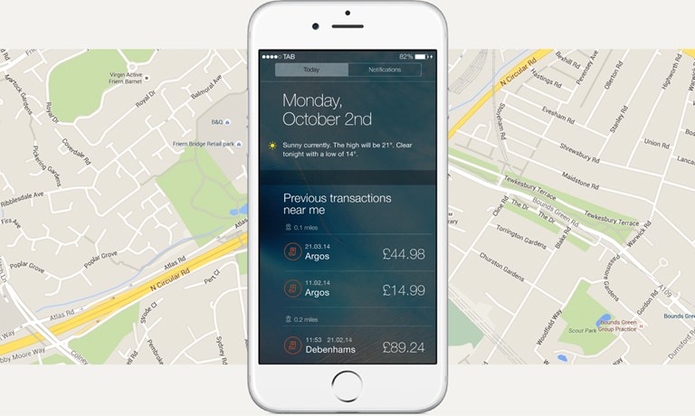 The image shows a light-colored mockup of a smartphone with the lock screen. On the lock screen "Previous transactions near me" are displayed, with two transactions in 0.1 miles and one transaction in 0.2 miles. The background around the smartphone is a minimalistic map of the area.