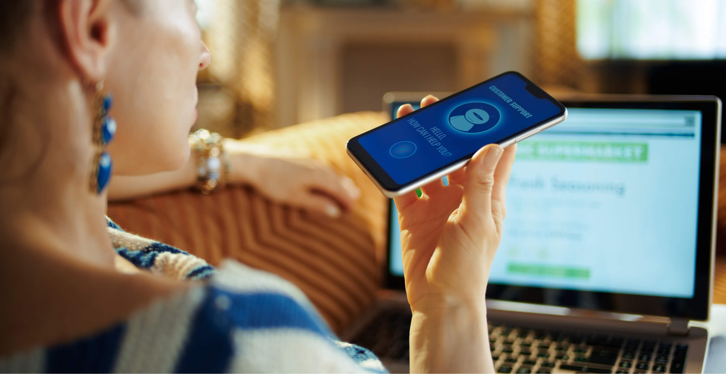 Woman using smartphone with AI-powered customer support app while shopping online.