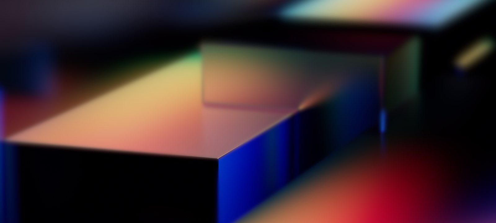 Abstract rendering of colorful geometric shapes with smooth gradient lighting, possibly representing Microsoft Fabric or a technology platform like Azure.