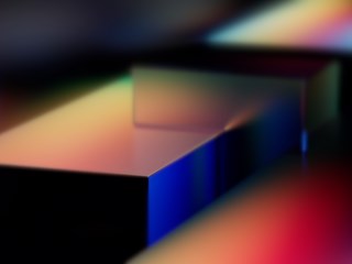 Abstract rendering of colorful geometric shapes with smooth gradient lighting, possibly representing Microsoft Fabric or a technology platform like Azure.