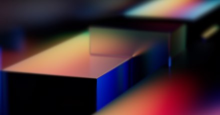 Abstract rendering of colorful geometric shapes with smooth gradient lighting, possibly representing Microsoft Fabric or a technology platform like Azure.