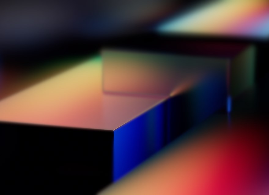 Abstract rendering of colorful geometric shapes with smooth gradient lighting, possibly representing Microsoft Fabric or a technology platform like Azure.
