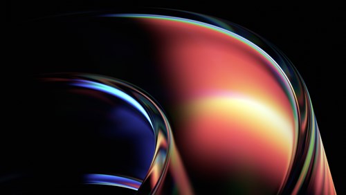 An abstract image featuring smooth, curved shapes with a glossy, reflective surface. The design transitions from rich, deep blues on the left to warm reds, oranges, and yellows on the right, creating a sense of fluid motion. The light highlights and reflections give the shapes a futuristic and dynamic feel, with the dark background adding depth and contrast. The combination of vibrant colors and sleek curves evokes innovation and cutting-edge technology.