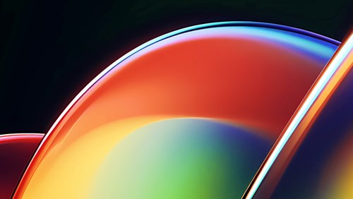An abstract image featuring smooth, overlapping curved shapes with glossy, reflective surfaces. The colors transition from vibrant reds and oranges on the left to bright yellows, greens, and deep blues on the right. The design creates a sense of fluidity and motion, with the light reflecting off the curves to emphasize their sleek, polished appearance. The dark background enhances the bright, bold colors, giving the image a modern and dynamic feel, often associated with technology and innovation.