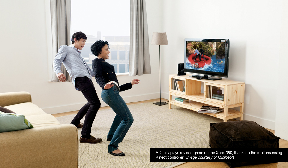 Man and woman playing Xbox Kinect